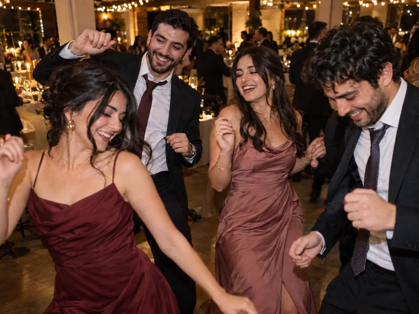 A guest's candid phone photo of friends laughing on the dance floor