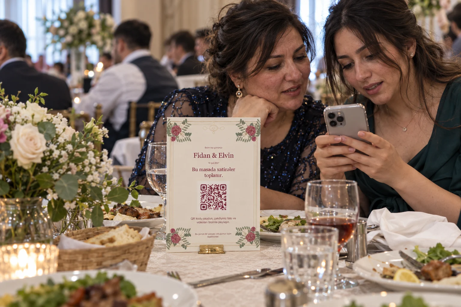 Guests share memories using Fidan and Elvin's portrait A5 QR table card with burgundy flowers